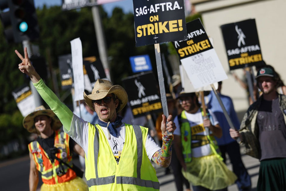 Picketers gather outside of Paramount Pictures Studios in Los Angeles, California. Caroline Brehman, EPA-EFE