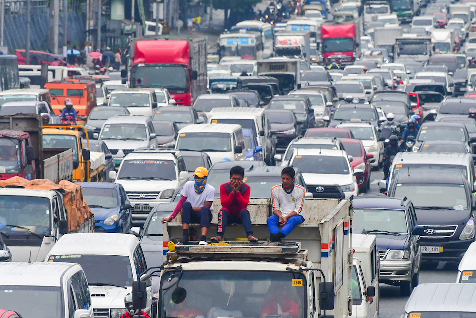 Traffic builds up along Commonwealth Avenue in Quezon City amid cloudy skies and light rain showers on August 8, 2022. Mark Demayo, ABS-CBN News/File.