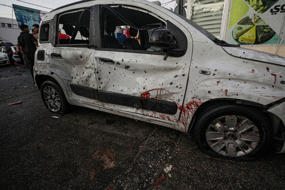 Blood splattered along the side of a car following an Israeli air strike close to Al Shifa hospital in Gaza City, 03 November 2023. More than 9,100 Palestinians and at least 1,400 Israelis have been killed, according to the Israel Defense Forces (IDF) and the Palestinian health authority, since Hamas militants launched an attack against Israel from the Gaza Strip on 07 October, and the Israeli operations in Gaza and the West Bank which followed it. EPA-EFE/MOHAMMED SABER
