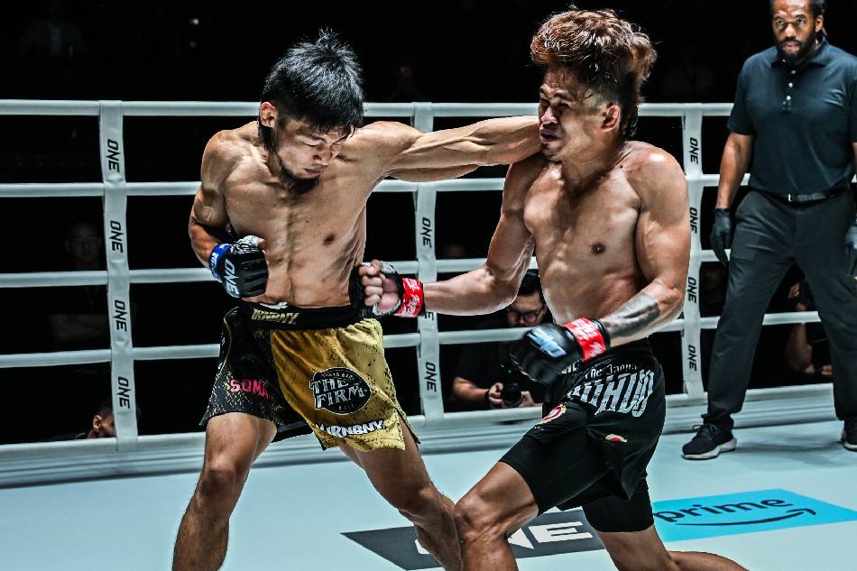 Lito Adiwang (L) exchanges strikes with fellow Filipino fighter Jeremy Miado at ONE Fight Night 16, November 4, 2023 in Bangkok, Thailand. Handout/ONE Championship. 