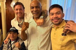 'Street fight anyone?' Pacquiao poses with his 'team'