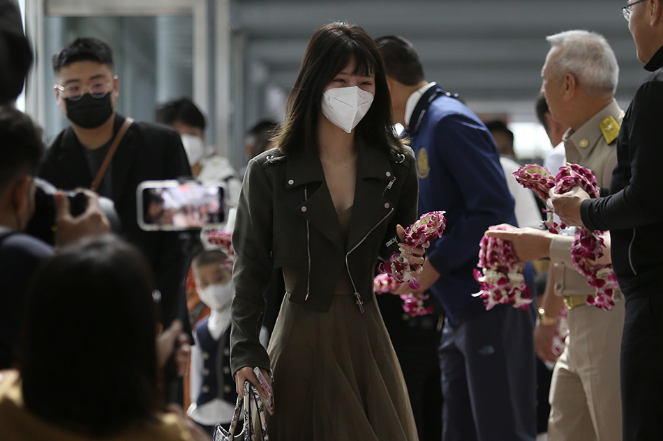 Chinese tourists are welcomed with garlands as they arrive at the Suvarnabhumi International Airport in Samut Prakan province, Thailand, 09 January 2023. Thailand welcomes the return of Chinese tourists without special COVID-19 health restrictions, aimed to boost the country