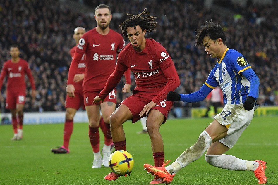 Brighton's Kaoru Mitoma (R) in action against Liverpool's Trent Alexander-Arnold (L) during the English Premier League soccer match between Brighton and Hove Albion and Liverpool FC in Brighton, Britain, 14 January 2023. Vince Mignott, EPA-EFE