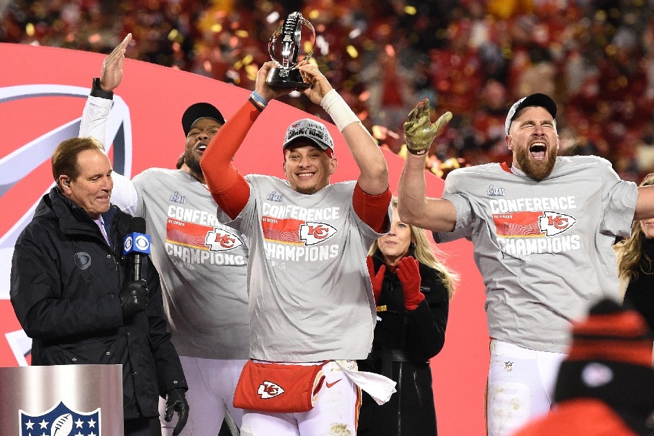 Kansas City Chiefs (L-R) Carlos Dunlap, Patrick Mahomes and Travis Kelce celebrate with the Lamar Hunt Trophy after defefating the Cincinnati Bengals in the AFC Championship game at GEHA Field at Arrowhead Stadium in Kansas City, Missouri, USA, 29 January 2023. Dave Kaup, EPA-EFE.