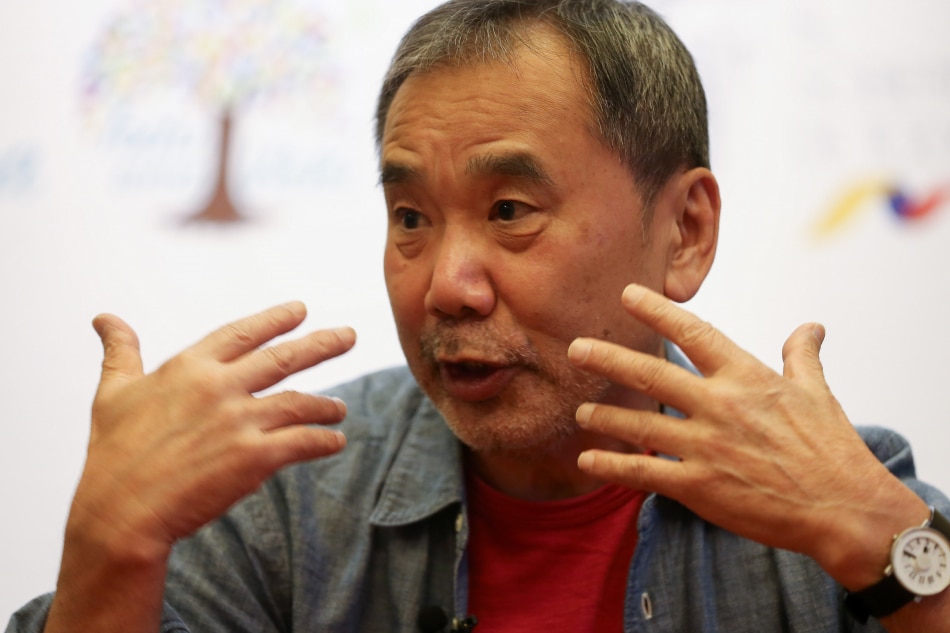 Japanese novelist Haruki Murakami speaks in Quito, Ecuado, Nov. 8, 2018. Jose Jacome, EPA-EFE/File