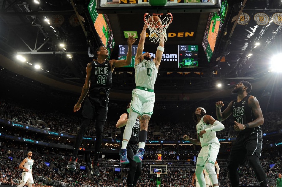Jayson Tatum (0) of the Boston Celtics dunks the ball during the game against the Brooklyn Nets at the TD Garden in Boston, Massachusetts. Brian Babineau, NBAE via Getty Images/AFP