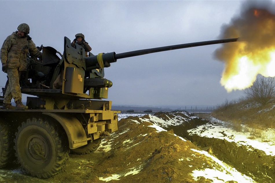 Ukrainian soldiers fire an anti-aircraft gun at a position near Bakhmut, Donetsk region, eastern Ukraine, 04 February 2023, amid Russia's invasion. EPA-EFE/SERGEY SHESTAK