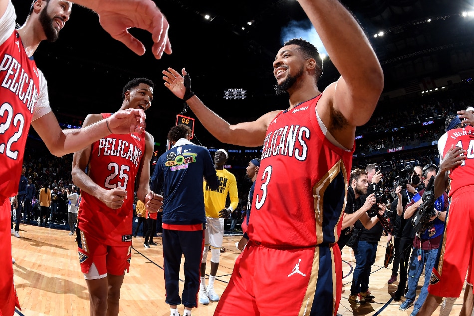 Larry Nance Jr. #22 and CJ McCollum #3 of the New Orleans Pelicans celebrate after the game against the Los Angeles Lakers on February 4, 2023 at the Smoothie King Center in New Orleans, Louisiana. Andrew D. Bernstein, NBAE via Getty Images/AFP