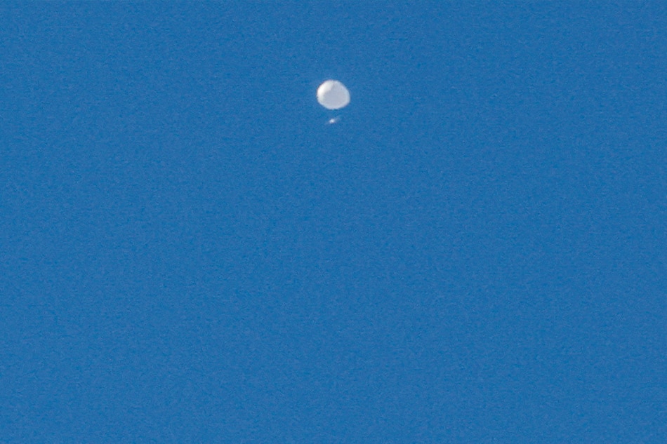 A high-altitude balloon, which the US government has stated is Chinese, is seen as it continues its multi-day path across the Northern United States in Charlotte, North Carolina, USA, 04 February 2023. US Secretary of State Blinken postponed a planned trip to China following the discovery of the balloon. The Pentagon said that the maneuverable Chinese surveillance balloon was posing 'no risk to commercial aviation, military assets or people on the ground'. EPA-EFE/NELL REDMOND
