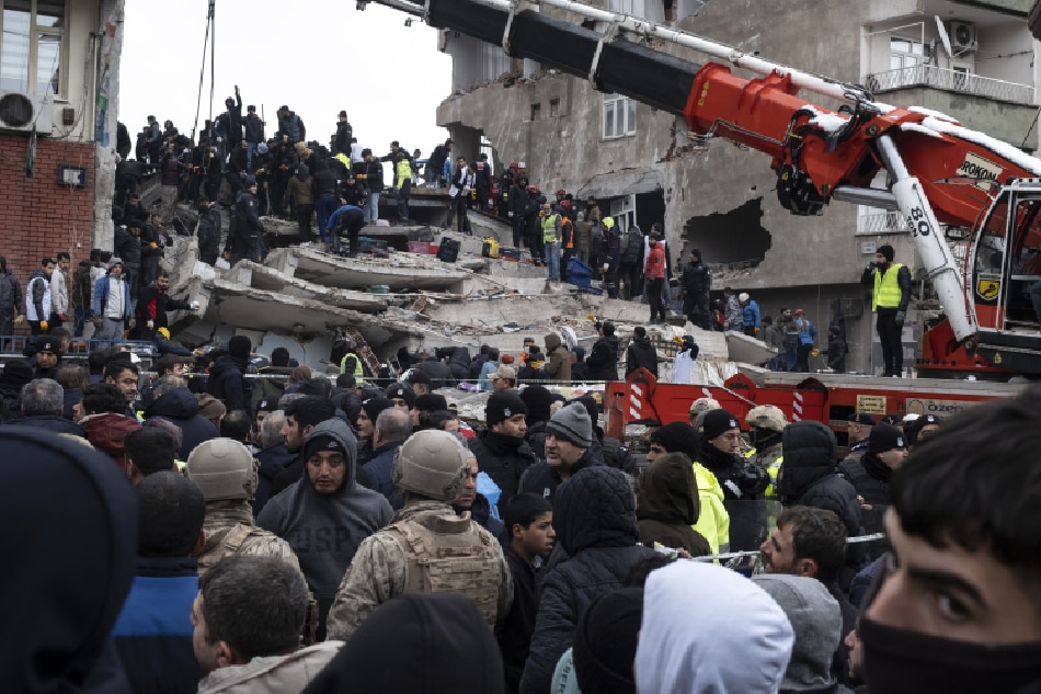 Emergency personnel search for victims at the site of a collapsed building after an earthquake in Diyarbakir, southeast of Turkey, 06 February 2023. According to the US Geological Service, an earthquake with a preliminary magnitude of 7.8 struck southern Turkey close to the Syrian border. The earthquake caused buildings to collapse and sent shockwaves over northwest Syria, Cyprus, and Lebanon. At least 912 people were confirmed dead and more than 5,000 have been injured in Turkey, the Turkish president said. EPA-EFE/REFIK TEKIN