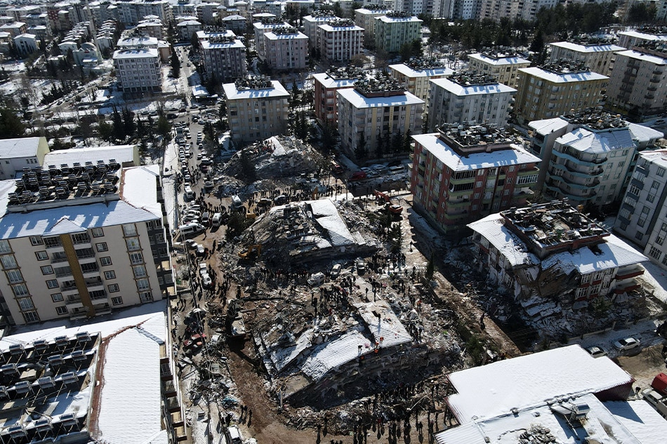 An aerial view taken with a drone shows collapsed buildings as rescue works continue in the aftermath of a major earthquake in the Besni district of Adiyaman city, Turkey, 08 February 2023. More than 11,000 people have died and thousands more injured after two major earthquakes struck southern Turkey and northern Syria on 06 February. Authorities fear the death toll will keep climbing as rescuers look for survivors across the region. Necati Savas, EPA-EFE