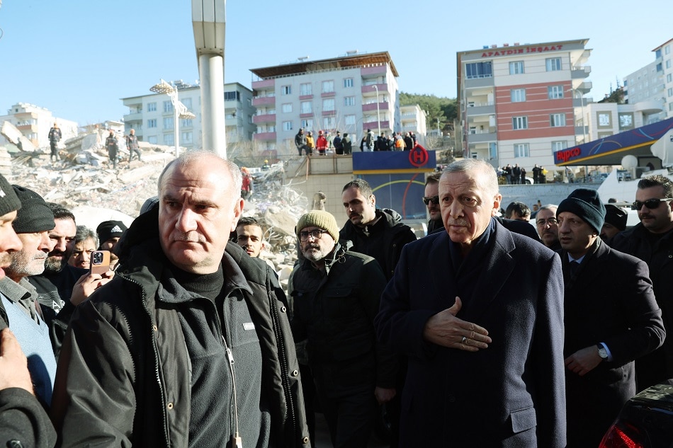A handout photo made available by Presidential press office shows Turkish President Recep Tayyip Erdogan (R) visits a collapsed building in the aftermath of a major earthquake in Hatay, Turkey, 08 February 2023. More than 11,000 people have died and thousands more are injured after two major earthquakes struck southern Turkey and northern Syria on 06 February. Authorities fear the death toll will keep climbing as rescuers look for survivors across the region. EPA-EFE/MURAT CETINMUHURDAR/PRESIDENTIAL PRESS OFFICE/HANDOUT