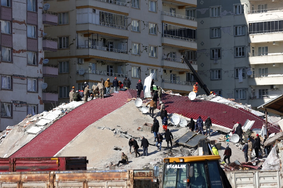 Rescue teams search the rubble of a collapsed building in the city of Kahramanmaras, southeastern Turkey, Feb. 8, 2023. More than 11,000 people have died and thousands more are injured after 2 major earthquakes struck southern Turkey and northern Syria on Feb. 6. Authorities fear the death toll will keep climbing as rescuers look for survivors across the region. Abir Sultan, EPA-EFE