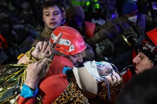 Father and daughter pulled from the rubble after being trapped for eight days