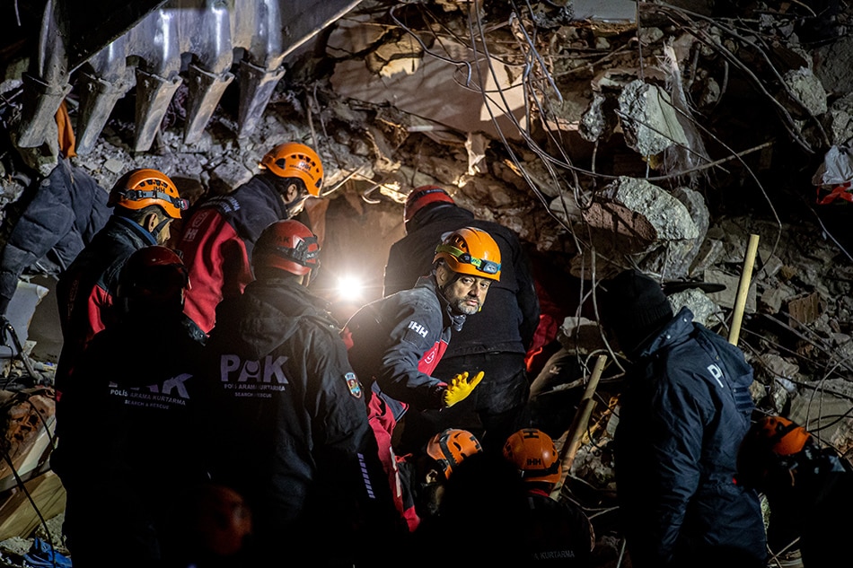 Rescuers work at the site of collapsed buildings after a powerful earthquake, in Hatay, Turkey, February 13, 2023. More than 35,000 people have died and thousands more are injured after two major earthquakes struck southern Turkey and northern Syria on 06 February. Authorities fear the death toll will keep climbing as rescuers look for survivors across the region. Martin Divisek, EPA-EFE
