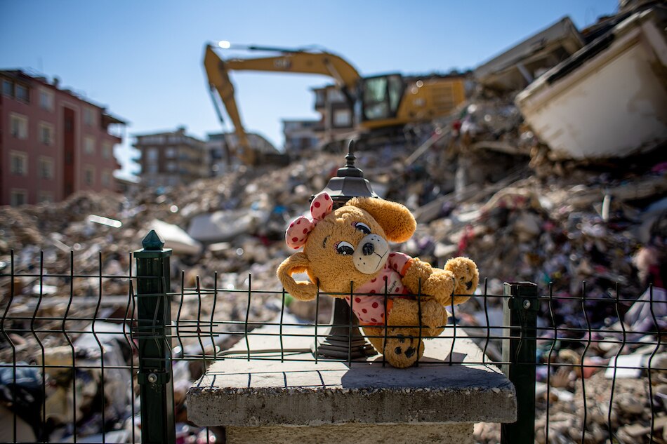 A stuffed toy animal is placed at the site of collapsed buildings after a powerful earthquake, in Hatay, Turkey on Feb. 17, 2023. Martin Divisek, EPA-EFE