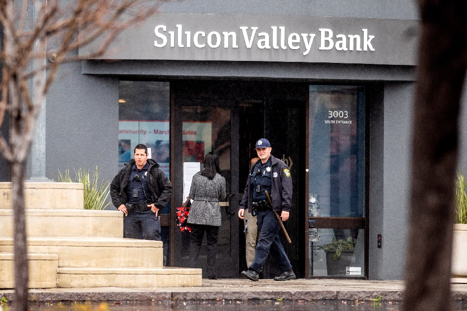Police officers leave Silicon Valley Bank’s headquarters in Santa Clara, California on March 10, 2023. US authorities swooped in and seized the assets of SVB, a key lender to US startups since the 1980s, after a run on deposits made it no longer tenable for the medium-sized bank to stay afloat on its own. NOAH BERGER / AFP