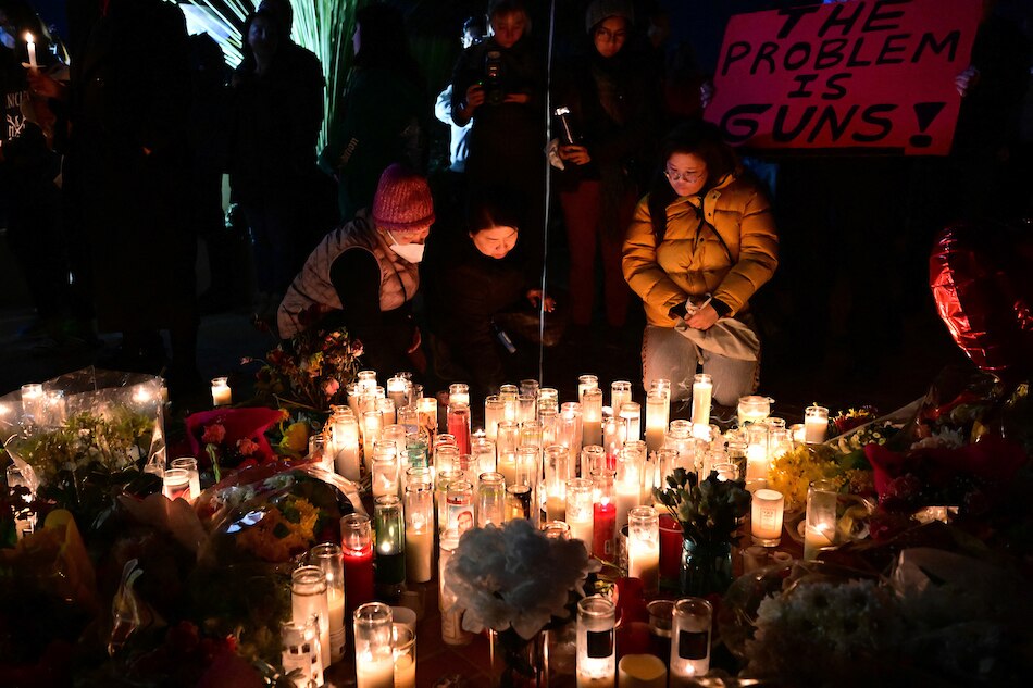 People pay tribute to the victims of the mass shooting at a candlelight vigil in front of City Hall in Monterey Park, California, on Jan. 24, 2023. Frederic J. Brown , AFP