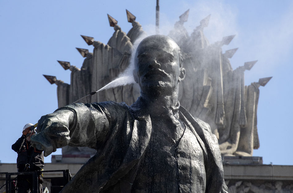 A municipal worker cleans the monument of Soviet state founder Vladimir Lenin from a crane during preparations for the 152th anniversary to Lenin’s birthday in St. Petersburg, Russia, 21 April 2022. The monument to Vladimir Lenin at the Moscow Square was installed in 1970. It was made according to the project of the sculptor Mikhail Anikushin and is the tallest monument to Lenin in St. Petersburg. EPA-EFE/ANATOLY MALTSEV