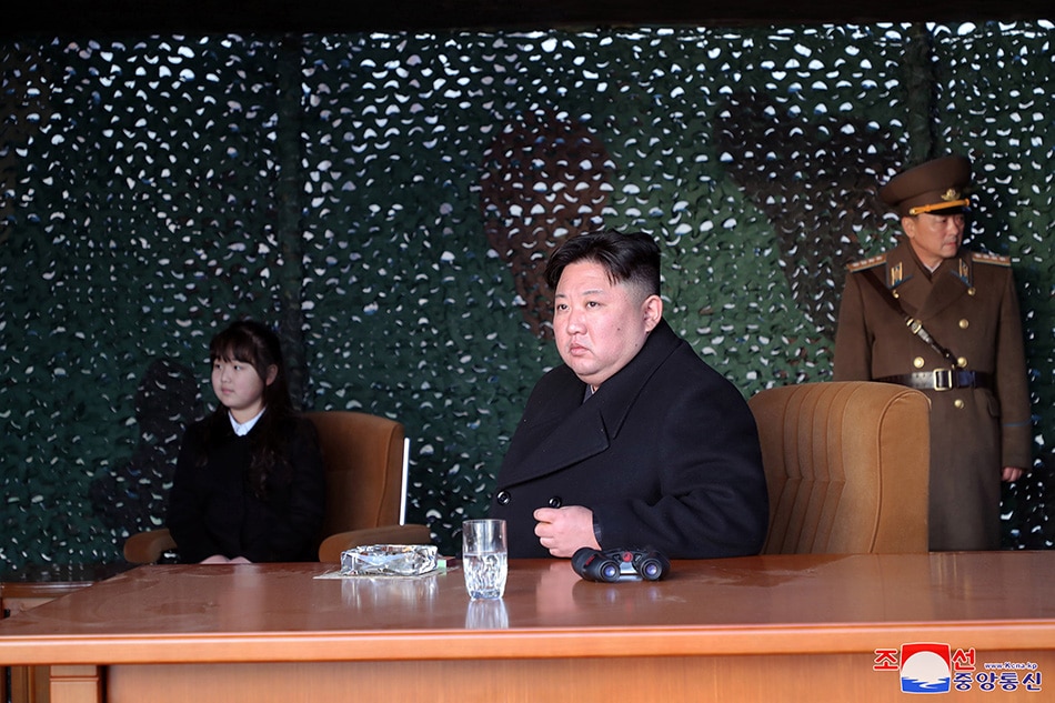 A photo released by the official North Korean Central News Agency (KCNA) shows Supreme Leader Kim Jong Un (C) and his daughter Kim Ju-ae (L) at an artillery drill in an undisclosed location in North Korea, 09 March 2023 (issued 10 March 2023). According to KCNA, Supreme Leader Kim Jong Un 'gave field guidance' at the 'fire assault drill' by the Hwasong artillery unit of the Korean People's Army. EPA-EFE/KCNA