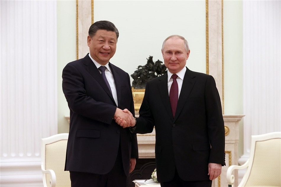 Russian President Vladimir Putin (R) shakes hands with Chinese President Xi Jinping (L) during their meeting in Moscow Kremlin in Moscow, Russia, 20 March 2023. Chinese President Xi Jinping arrived in Moscow on a three-day visit, which will last from March 20 to 22, according to Russian and Chinese state agencies. Xi Jinping visits Russia on improving joint partnership and developing key areas of Russian-Chinese economic cooperation. EPA-EFE/SERGEI KARPUHIN / SPUTNIK / KREMLIN POOL