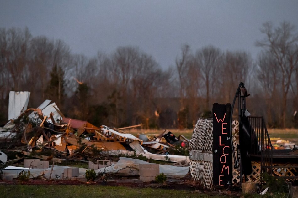 Only a 'Welcome' sign and part of a front porch remains of a home destroyed in the small rural community of Wren, Mississippi, USA, March 25, 2023. At least 25 people have been killed after an overnight tornado and severe weather outbreak tore through the US state of Mississippi. Thomas Graning, EPA-EFE.