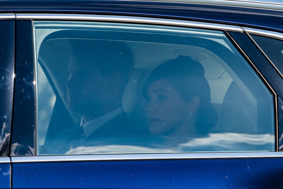 Britain's Prince Harry, Duke of Sussex (L) and Meghan, Duchess of Sussex leave following the procession of the coffin containing the body of Britain's Queen Elizabeth II to Westminster Hall in London, Britain, 14 September 2022. EPA-EFE/GUY BELL