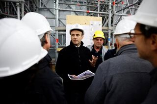 Macron signs France pension reform into law despite protests