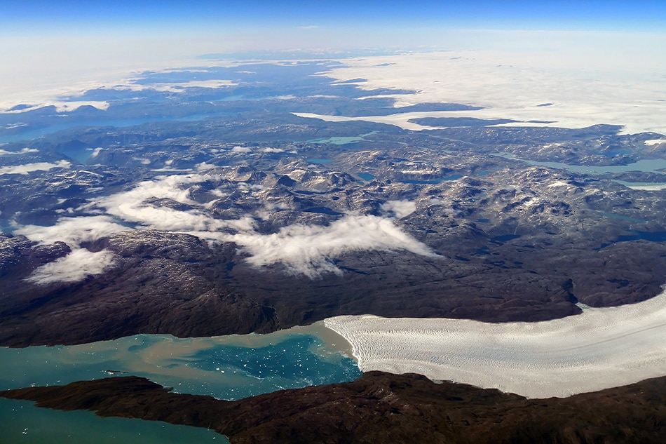 An aerial view shows the wild landscape, ice flows and glaciers of Greenland, seen through an airplane window on 22 July 2018 (issued 23 July 2018). Ian Langsdon, EPA-EFE