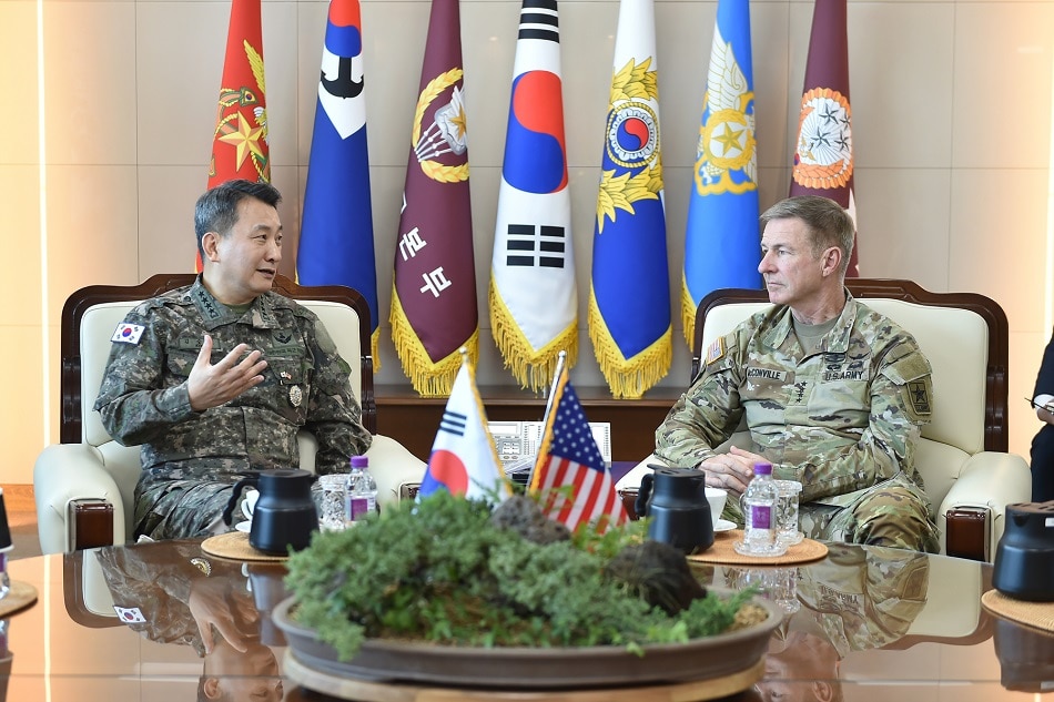 A handout photo made available by South Korea's Joint Chiefs of Staff (JCS), shows JCS Chairman Gen. Kim Seung-kyum (L) as he talks with US Army Chief of Staff Gen. James McConville at the JCS headquarters in Seoul, South Korea, 09 May 2023. EPA-EFE/YONHAP