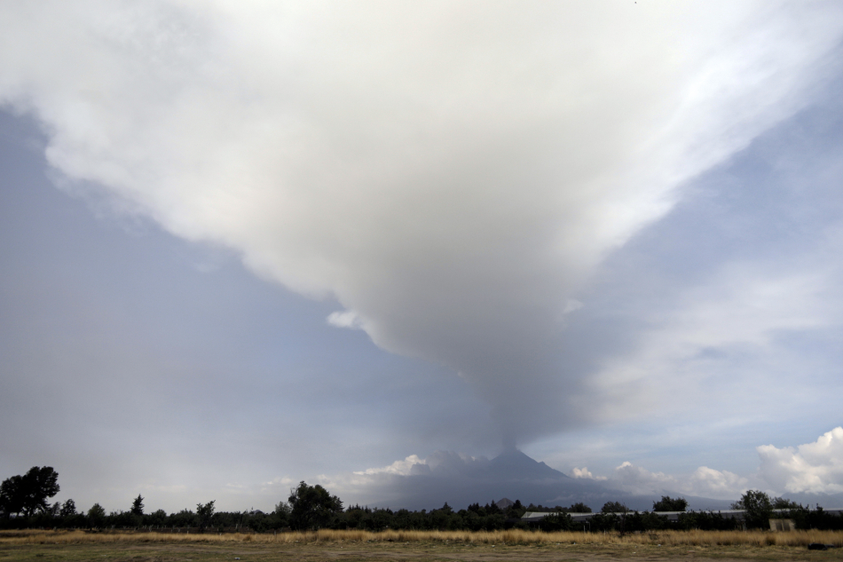 A general view showing the activity of the Popocatepetl volcano from the municipality of Nealtican, in the state of Puebla, Mexico, 21 May 2023. The volcanic traffic light increased its intensity to 