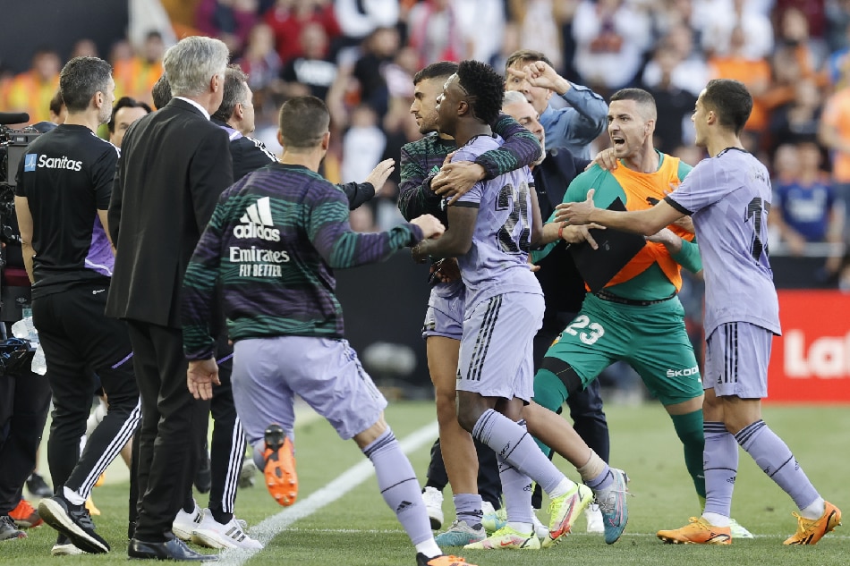 Real Madrid's striker Vinicius Junior (C) reacts after receiving a red card during the Spanish LaLiga soccer match between Valencia CF and Real Madrid in Valencia, Spain, May 21, 2023. Kai Forsterling, EPA-EFE