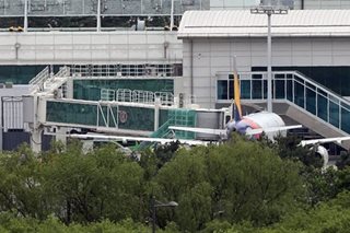 Man who opened plane door mid-flight says he wanted out 'quickly'
