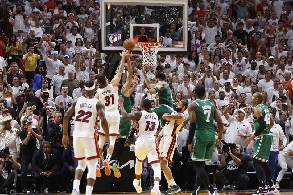 Boston Celtics guard Derrick White (3-R) tips in the winning basket as the buzzer sounds during the second half of the NBA basketball Eastern Conference Finals playoff game six between the Miami Heat and the Boston Celtics at the Kaseya Center in Miami, Florida, USA, 27 May 2023. Rhona Wise, EPA-EFE/Shutterstock