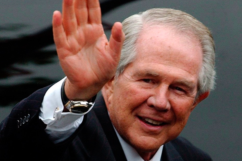 In this file photo dated Friday 11 June 2004 U.S. Televangelist Pat Robertson waves as he leaves Washington National Cathedral after the funeral of former US President Ronald Reagan in Washington, DC Friday 11 June 2004. EPA/JUSTIN LANE