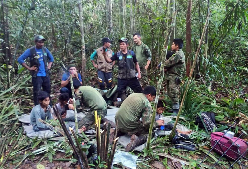 A handout photo made available by the Military Forces of Colombia shows soldiers and indigenous people as they attend to the children rescued after 40 days in the jungle, in Guaviare, Colombia, June 9, 2023. The 4 children who had been lost since May 1, 2023 in the jungles of southern Colombia after the plane in which they were traveling along with three adults crashed, were found alive by soldiers who participated in their search, official sources reported. EPA-EFE/Military Forces of Colombia/Handout