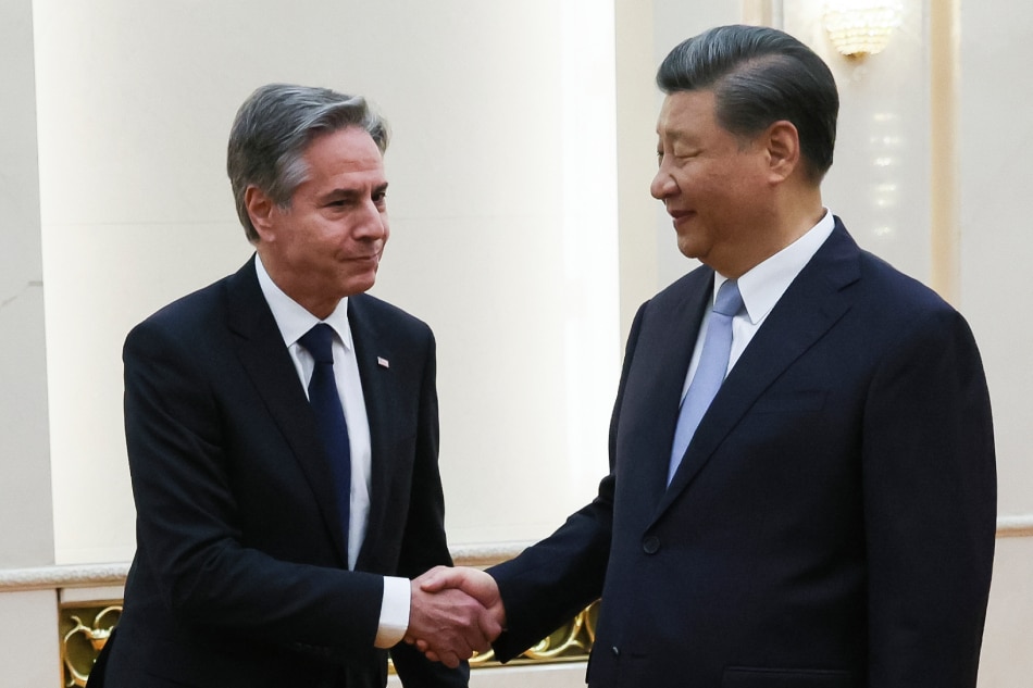 US Secretary of State Antony Blinken (L) shakes hands with China's President Xi Jinping at the Great Hall of the People in Beijing on June 19, 2023. President Xi Jinping hosted Antony Blinken for talks in Beijing on June 19, capping two days of high-level talks by the US secretary of state with Chinese officials. (Photo by Leah MILLIS / POOL / AFP)