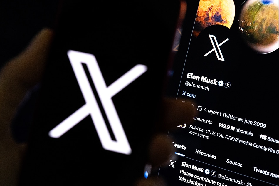 An illustration pictures shows a user holding a mobile phone displaying the 'X' logo in front of Elon Musk's page in Los Angeles, California, USA, July 27, 2023. Twitter announced on July 23 that it will rebrand to X. Etienne Laurent, EPA-EFE