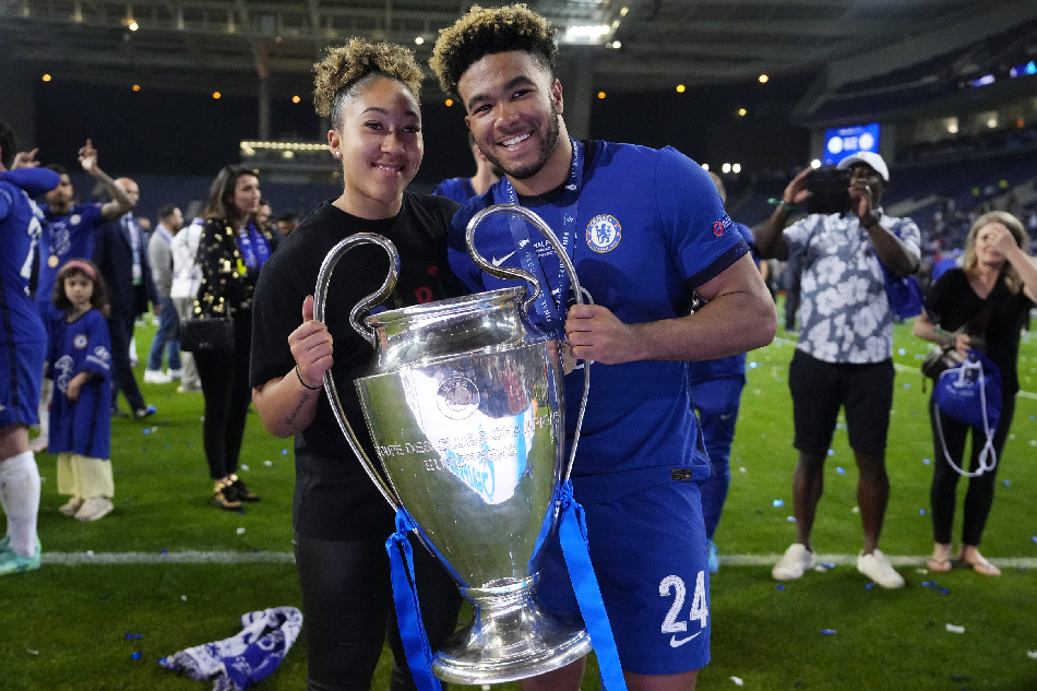 Reece James of Chelsea and his sister Lauren James poses with the trophy after Chelsea won the UEFA Champions League final between Manchester City and Chelsea FC in Porto, Portugal, May 29, 2021. Manu Fernandez, EPA-EFE/File.