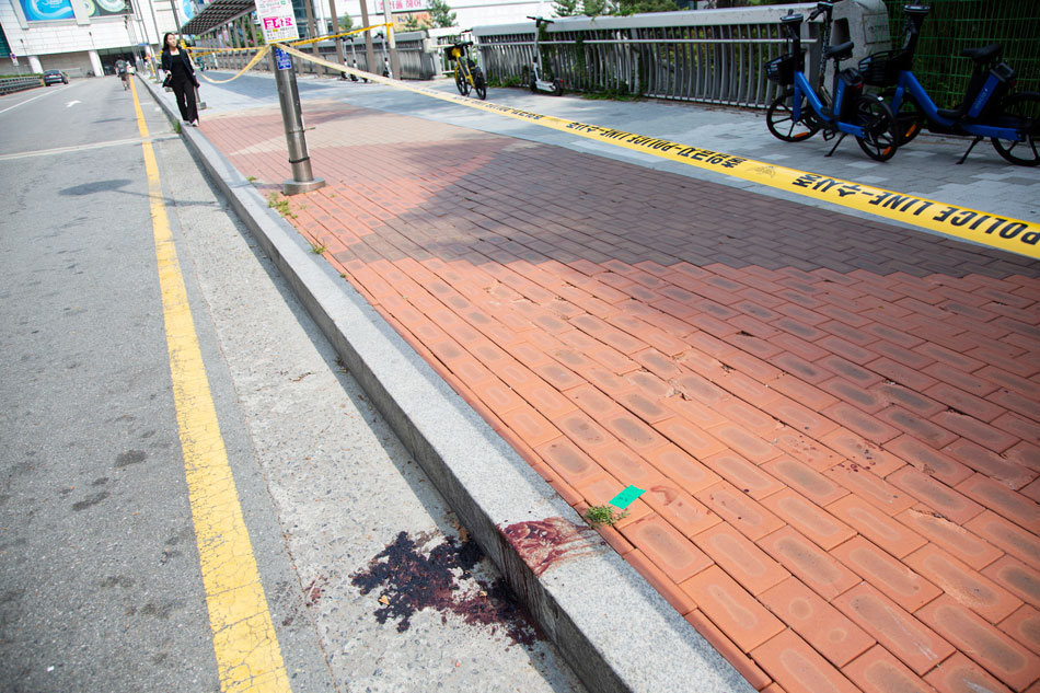 Blood stains on a street after a stabbing rampage took place at a department store in Seongnam, South Korea, 04 August 2023. A man in his 20s randomly stabbed and wounded 14 people at a department store adjacent to the Seohyeon subway station in Seongnam city on 03 August 2023. According to rescue authorities, two of the victims are in critical condition and could become brain dead. EPA-EFE/JEON HEON-KYUN