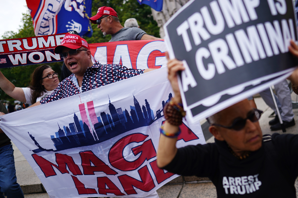 Protesters gather outside the entrance to the E. Barrett Prettyman United States Courthouse, where Judge Tanya Sue Chutkan will arraign former US President Donald J. Trump in Washington, DC, USA, 03 August 2023. A federal grand jury has indicted Trump over his efforts to overturn the 2020 presidential election. EPA-EFE/WILL OLIVER