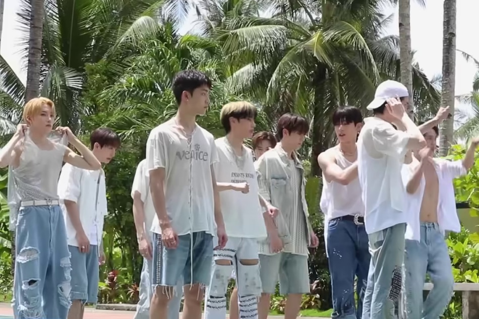 The members of K-pop group The Boyz shoot a scene for their 'Lip Gloss' music video at a basketball court in Siargao Island. Screenshot from video on The Boyz's YouTube channel