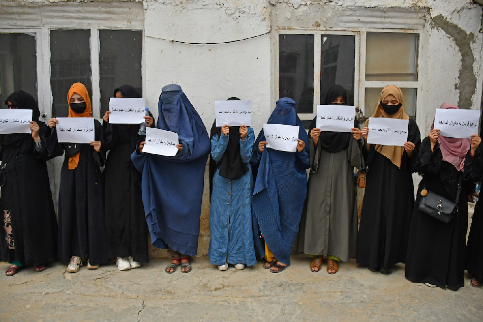 In one of rare occasions, Afghan women hold placards demanding their right to education, in Mazar-i-Sharif on June 26, 2023. The supreme leader of the Taliban, Hibatullah Akhundzada, released a message Sunday claiming the Afghan government has taken the necessary steps for the betterment of women