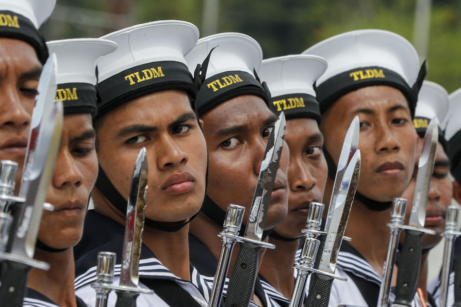 Members of the Royal Malaysian Navy (RMN) take part in the Trooping of Colours ceremony, in conjunction with Malaysian King Sultan Muhammad V