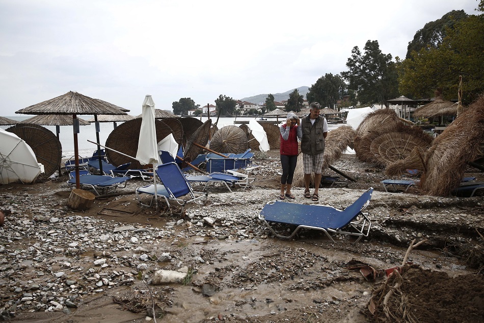 People look at the damages at a beach during the storm named Daniel in the area of Kala Nera at Pilio, Magnesia, Greece, September 6, 2023. At least two people died as unprecedented bad weather conditions have stricken the region of Magnesia and the city of Volos on September 5. Yannis Kolesidis, EPA-EFE. 