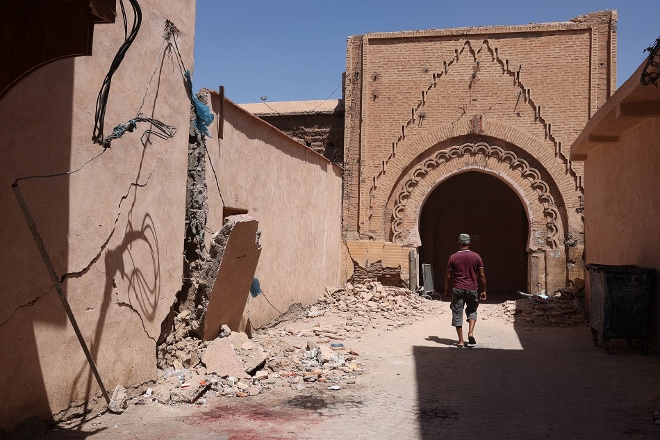 A man walks on a street with damaged buildings that collapsed in a powerful earthquake in Marrakech, Morocco, 10 September 2023. Tiago Petinga, EPA-EFE