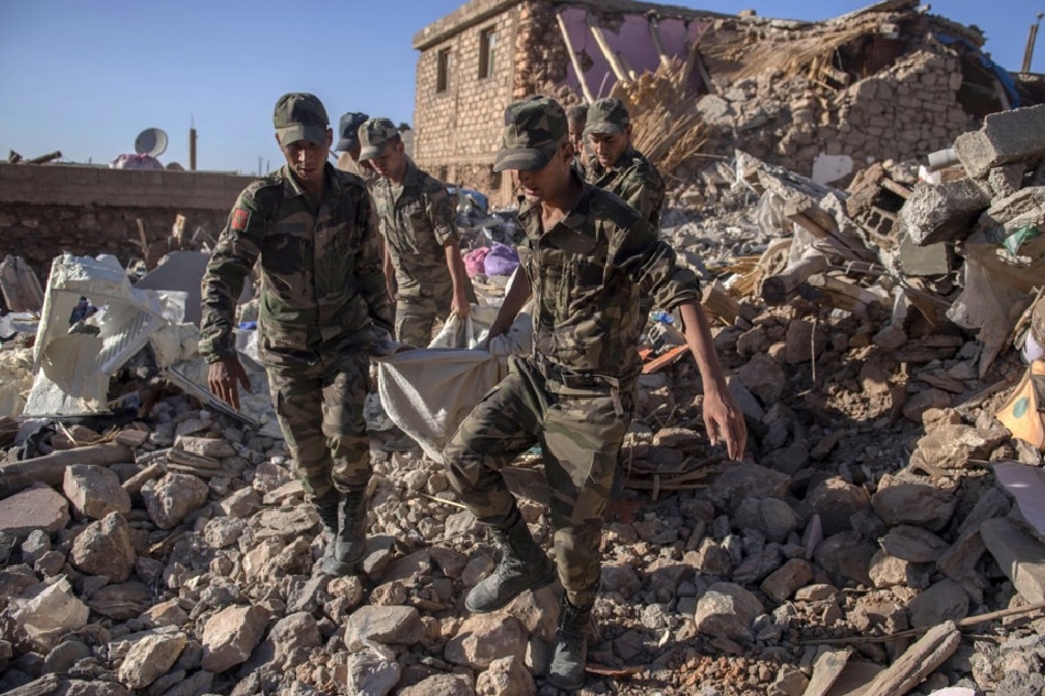 The army recovers the corpses of earthquake victims, in Tafeghaghte, Morocco, on September 9, 2023. The earthquake, measuring magnitude 6.8 according to the USGS, damaged buildings from villages and towns in the Atlas Mountains to Marrakesh. Jalal Morchidi, EPA-EFE
