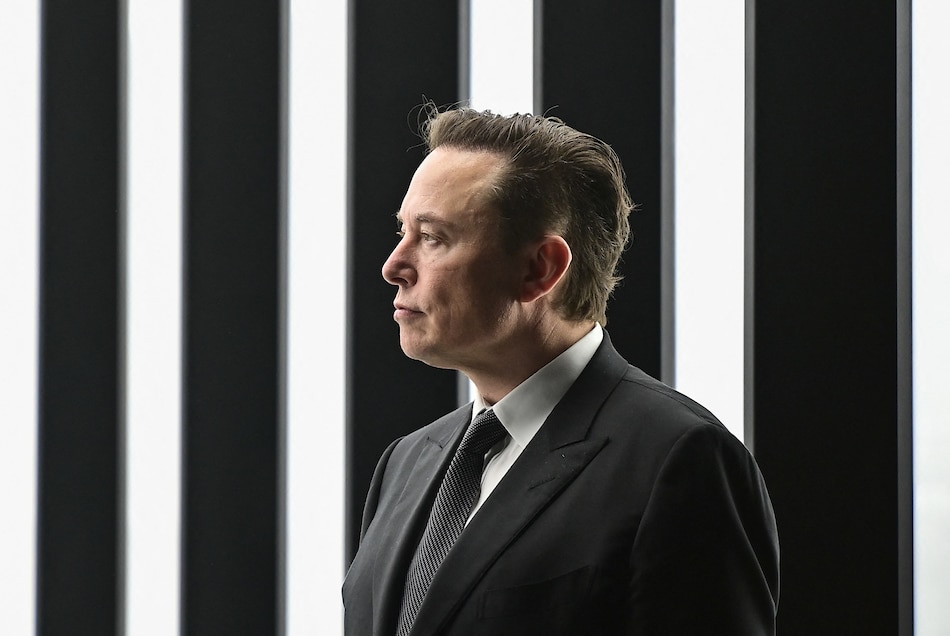 In this file photo taken on March 22, 2022, Tesla CEO Elon Musk is pictured as he attends the start of the production at Tesla's 'Gigafactory' in Gruenheide, southeast of Berlin. Patrick Pleul, Pool/AFP