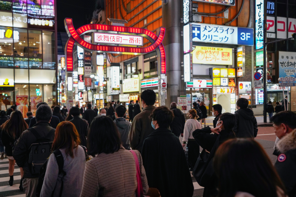 Pedestrians walk at Kabukicho, Shinjuku, Japan's biggest entertainment area in Tokyo, Japan, Dec. 9, 2020. Kimimasa Mayama, EPA-EFE/File