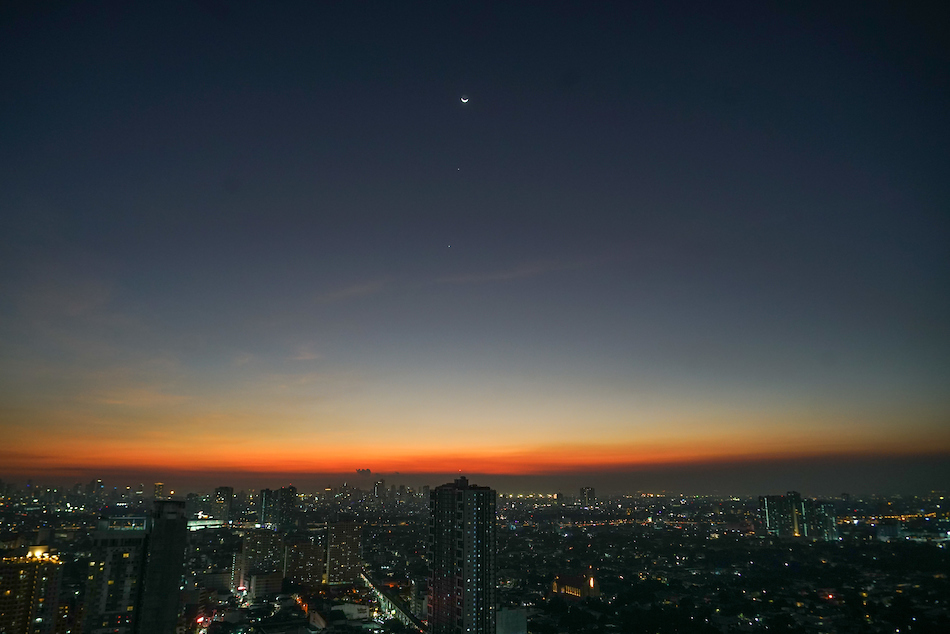 The Moon, Jupiter (center) and Venus (bottom) align as viewed on the western sky minutes after sunset in this photo taken from Barangay Kaunlaran, Quezon City on Feb. 23, 2023. Gigie Cruz, ABS-CBN News/File